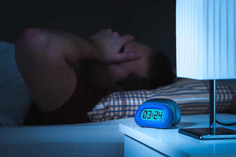 Person in bed unable to sleep at 3:24 am
